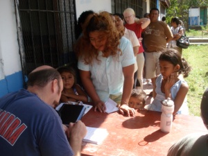 Justin gathering medical information from patients
